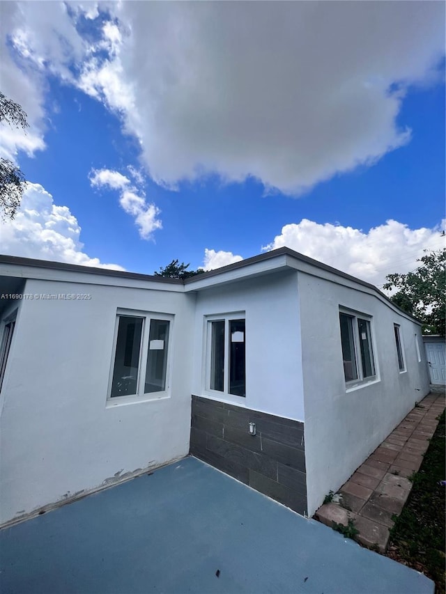 3731 SW 58th Ter, Davie, FL 33314 - view of property exterior with a patio