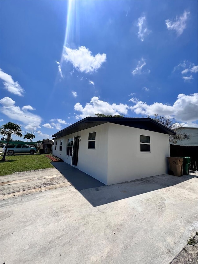 3731 SW 58th Ter, Davie, FL 33314 - view of home's exterior with a patio area