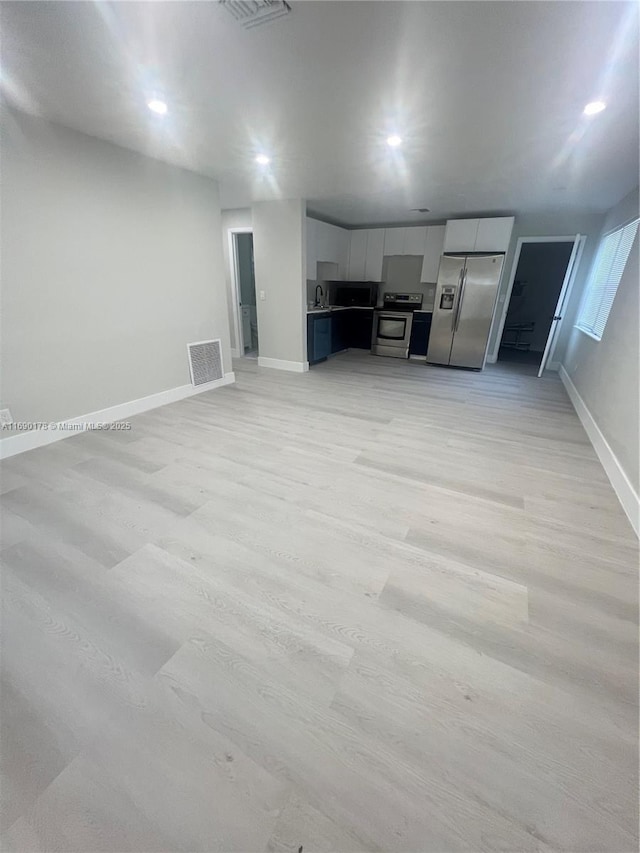3731 SW 58th Ter, Davie, FL 33314 - unfurnished living room with light hardwood / wood-style flooring