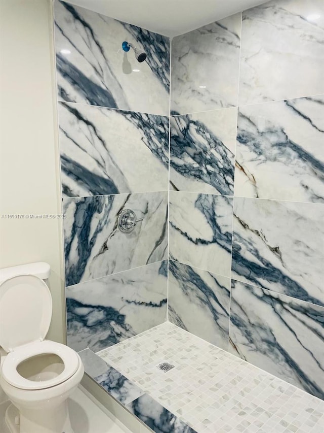 3731 SW 58th Ter, Davie, FL 33314 - bathroom featuring a tile shower and toilet