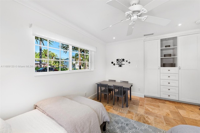 bedroom featuring ceiling fan, a closet, and crown molding