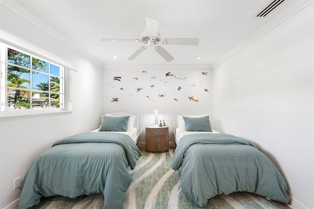 bedroom with hardwood / wood-style floors, ceiling fan, and crown molding