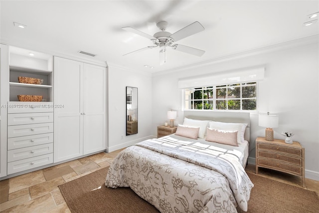 bedroom with ceiling fan and crown molding