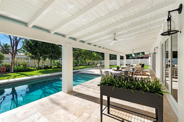 view of swimming pool featuring a patio and ceiling fan