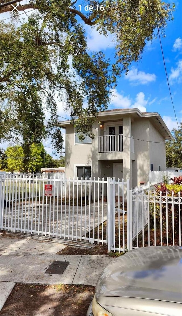 view of front of house featuring a balcony