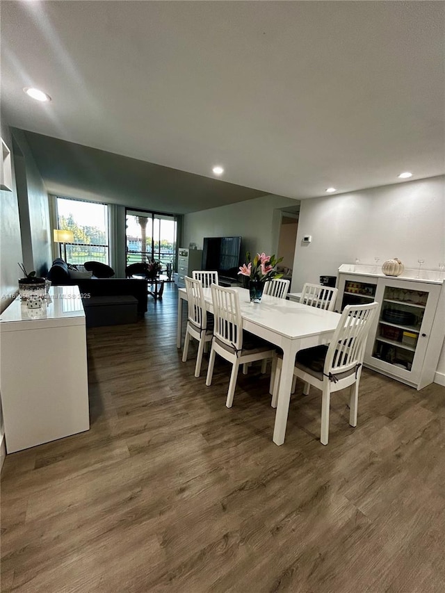 dining area featuring dark hardwood / wood-style floors