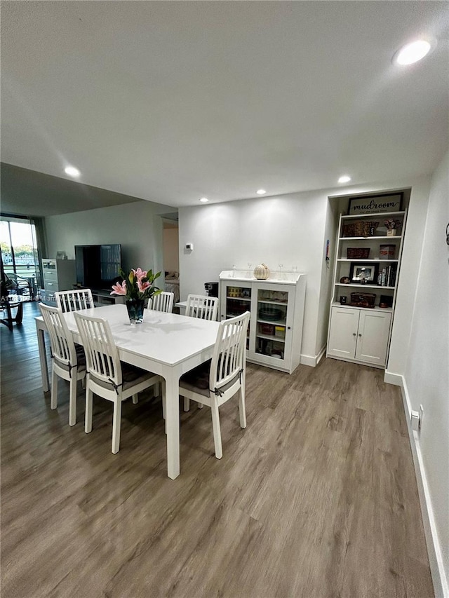 dining area with wood-type flooring