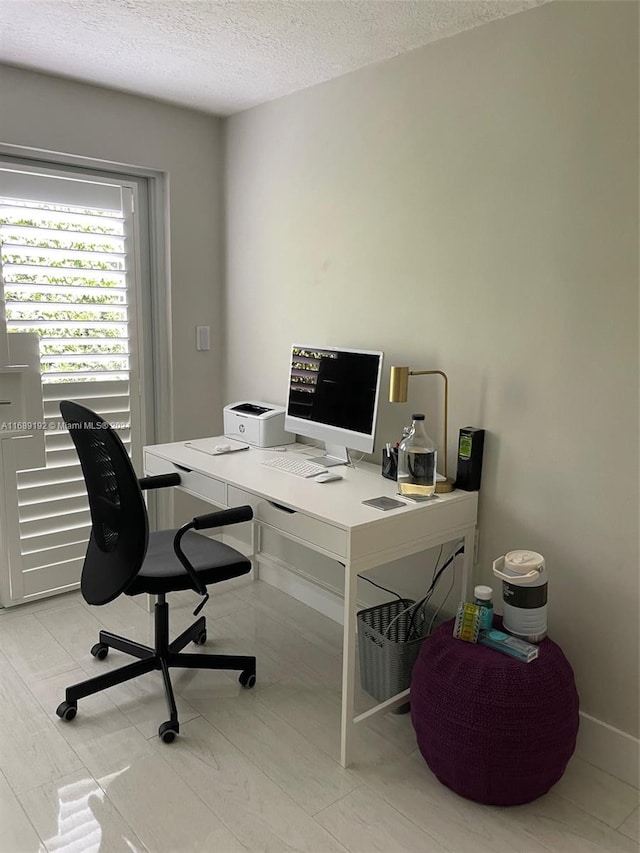 office area featuring a textured ceiling