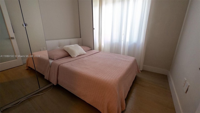 bedroom with light hardwood / wood-style floors