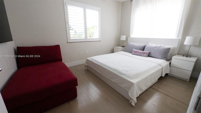 bedroom with light wood-type flooring