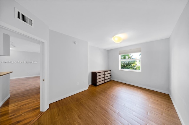 spare room featuring hardwood / wood-style flooring