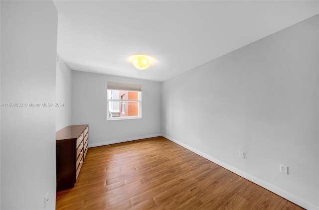 unfurnished room with light hardwood / wood-style floors