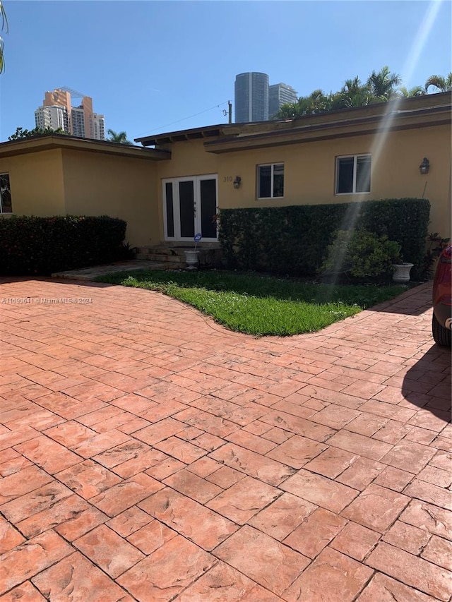 back of house featuring french doors and a patio area