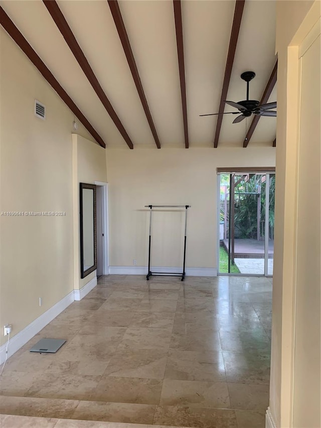 empty room with ceiling fan and beam ceiling