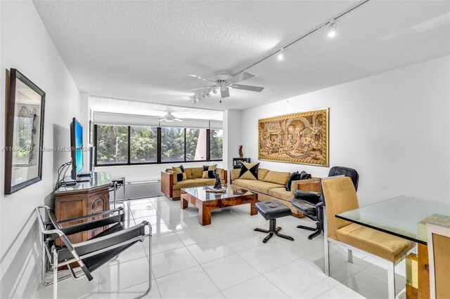 6320 Boca Del Mar Dr Unit 207, Boca Raton, FL 33433 - living area featuring a ceiling fan, track lighting, a textured ceiling, and light tile patterned floors