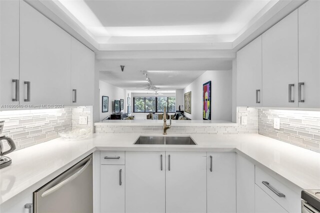 6320 Boca Del Mar Dr Unit 207, Boca Raton, FL 33433 - kitchen with stainless steel dishwasher, a sink, light countertops, and tasteful backsplash