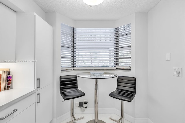 dining area with a textured ceiling