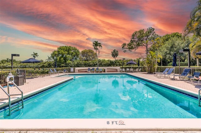 6320 Boca Del Mar Dr Unit 207, Boca Raton, FL 33433 - pool at dusk with a patio and a community pool