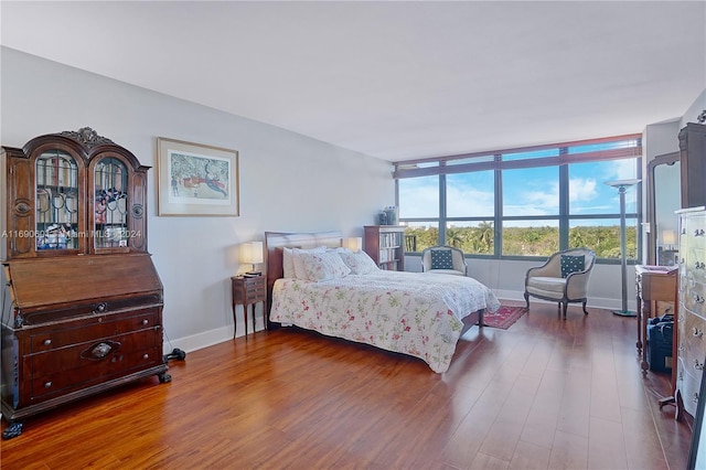 bedroom featuring dark hardwood / wood-style flooring