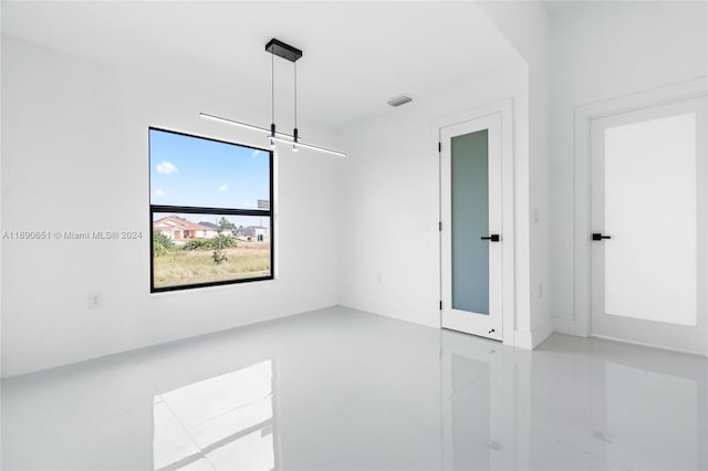 empty room with light tile patterned floors