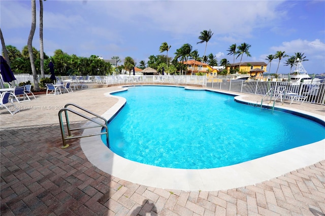 view of swimming pool with a patio area