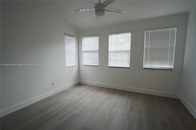 123 Harbors Way, Boynton Beach, FL 33435 - spare room featuring wood finished floors, baseboards, ceiling fan, and vaulted ceiling