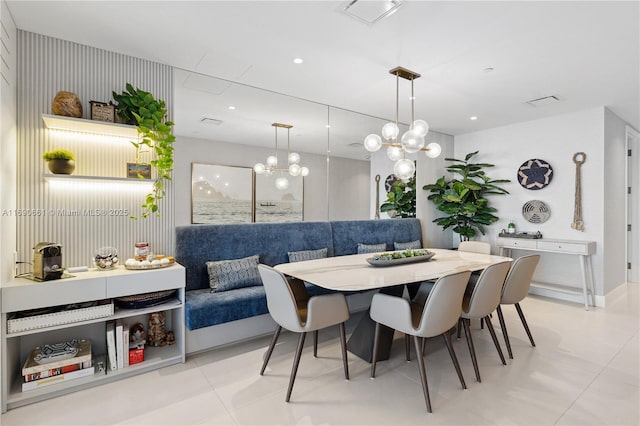 dining room featuring breakfast area and light tile patterned floors