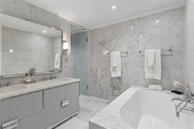 bathroom with a tub, ornamental molding, and tile walls