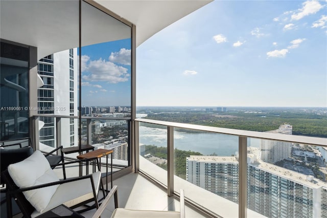 balcony featuring a water view