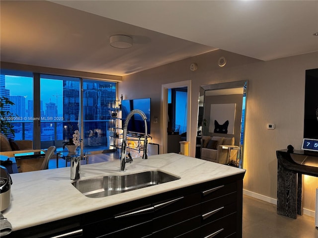 200 Biscayne Boulevard Way Unit 3110, Miami, FL 33131 - kitchen with a sink, baseboards, and light countertops