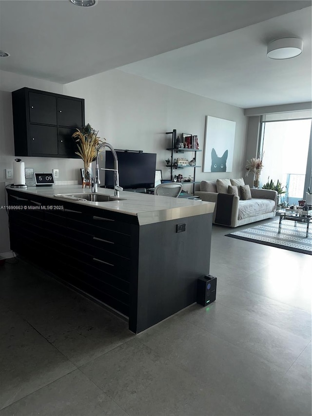 200 Biscayne Boulevard Way Unit 3110, Miami, FL 33131 - kitchen with dark cabinetry, a sink, finished concrete floors, modern cabinets, and light countertops