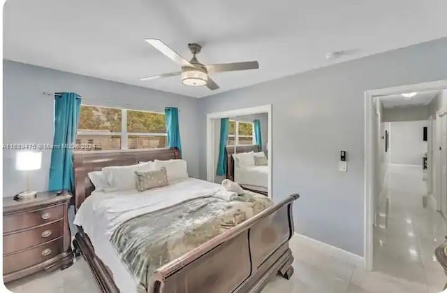 bedroom featuring ceiling fan and multiple windows