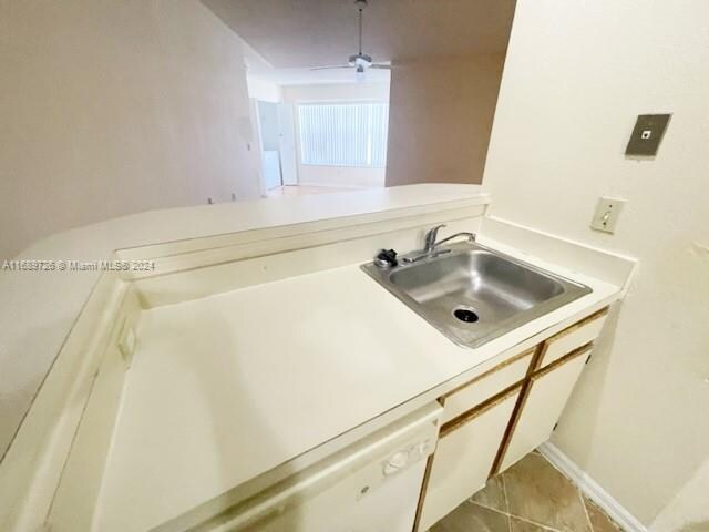 bathroom featuring tile patterned flooring and sink