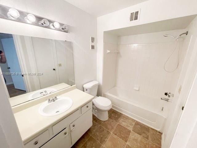 full bathroom with vanity, toilet, and bathtub / shower combination