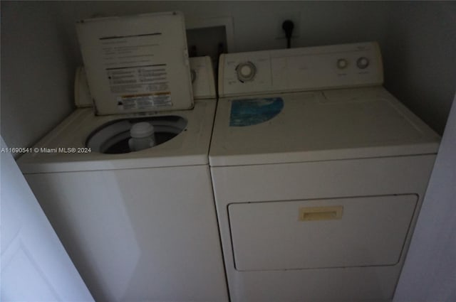 laundry area with independent washer and dryer