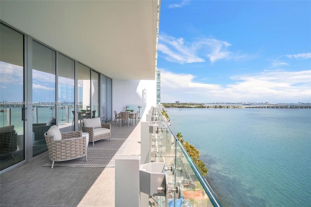 balcony featuring a water view