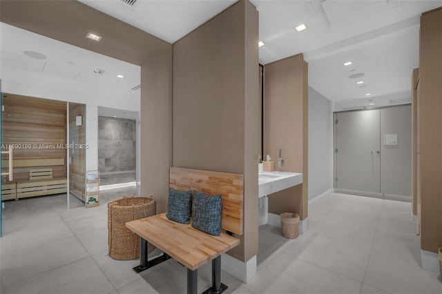 corridor with recessed lighting and tile patterned floors