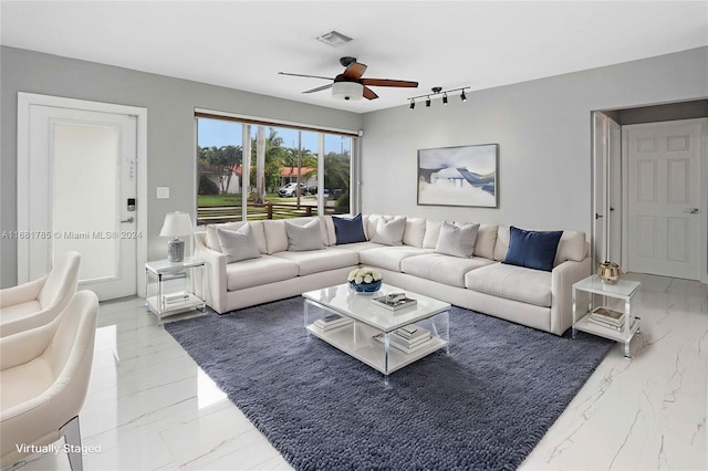 living room featuring ceiling fan