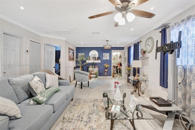 living room with light tile patterned flooring, ceiling fan, and crown molding