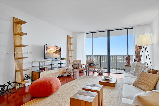 780 NE 69th St Unit 2506, Miami, FL 33138 - living area featuring expansive windows and wood finished floors