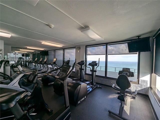 exercise room with a textured ceiling