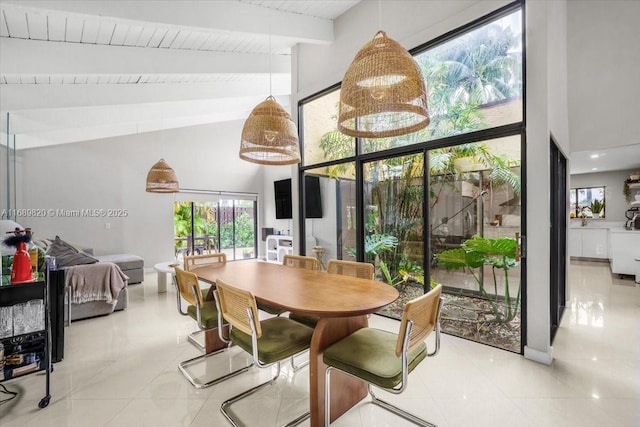 dining room with beamed ceiling, wood ceiling, and high vaulted ceiling