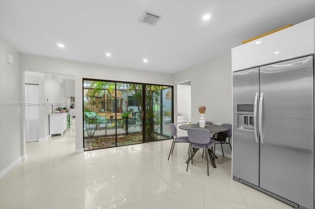 dining area featuring light tile patterned flooring, recessed lighting, and visible vents