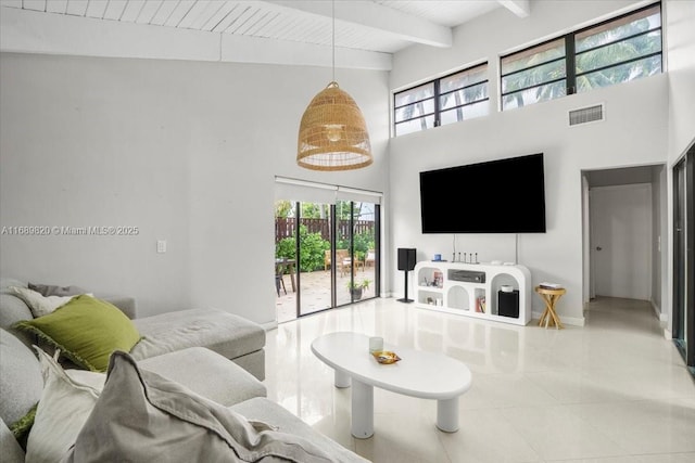 living room with visible vents, beamed ceiling, wood ceiling, a towering ceiling, and tile patterned floors