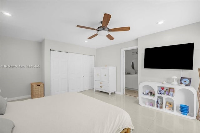 bedroom with light tile patterned floors, recessed lighting, baseboards, and a closet