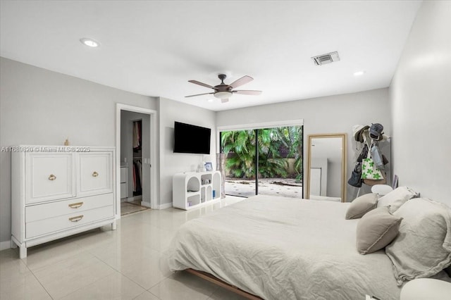 bedroom with light tile patterned floors, visible vents, a ceiling fan, and baseboards