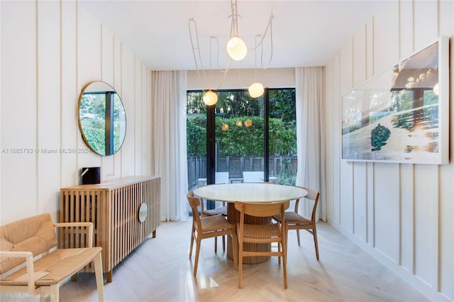 dining room featuring light parquet floors