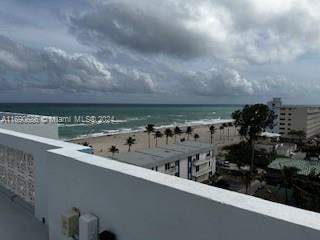 view of water feature with a beach view