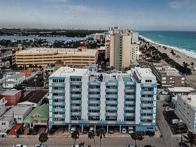 aerial view featuring a beach view and a water view