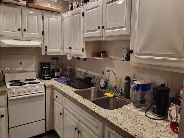 kitchen with tasteful backsplash, white cabinetry, extractor fan, sink, and white electric range